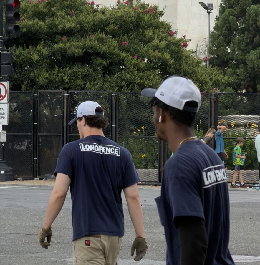 Crew on the job site, one wearing the tan cargo pants